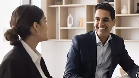 two persons talking