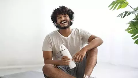 person sitting and smiling