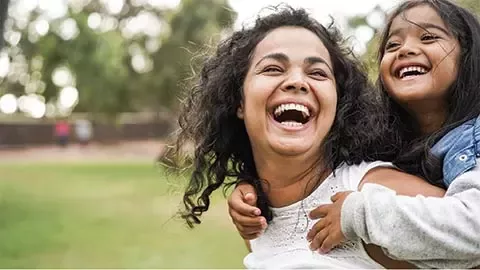 two persons smiling